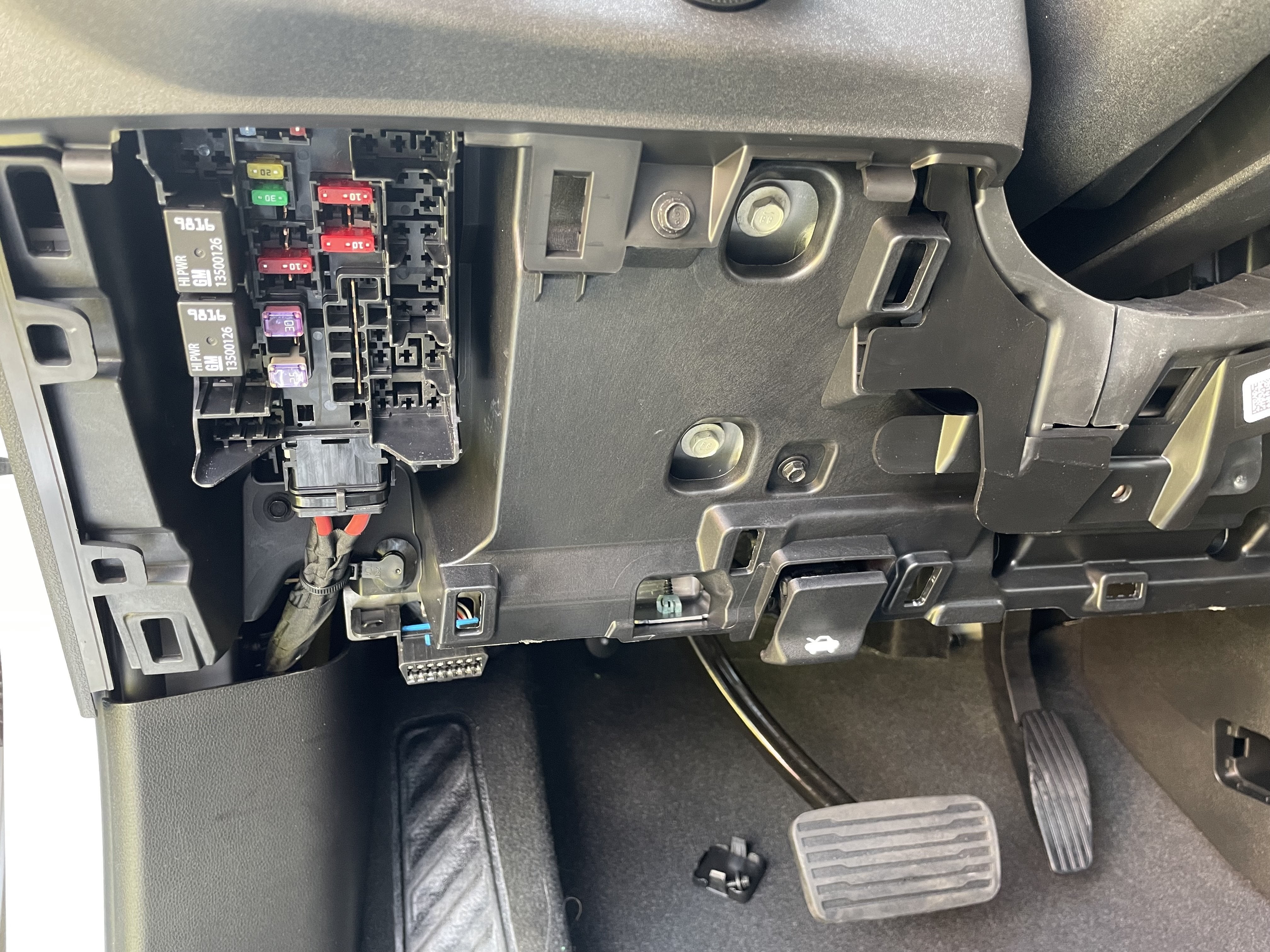 Fuse panel access for 12V power supply connection in truck