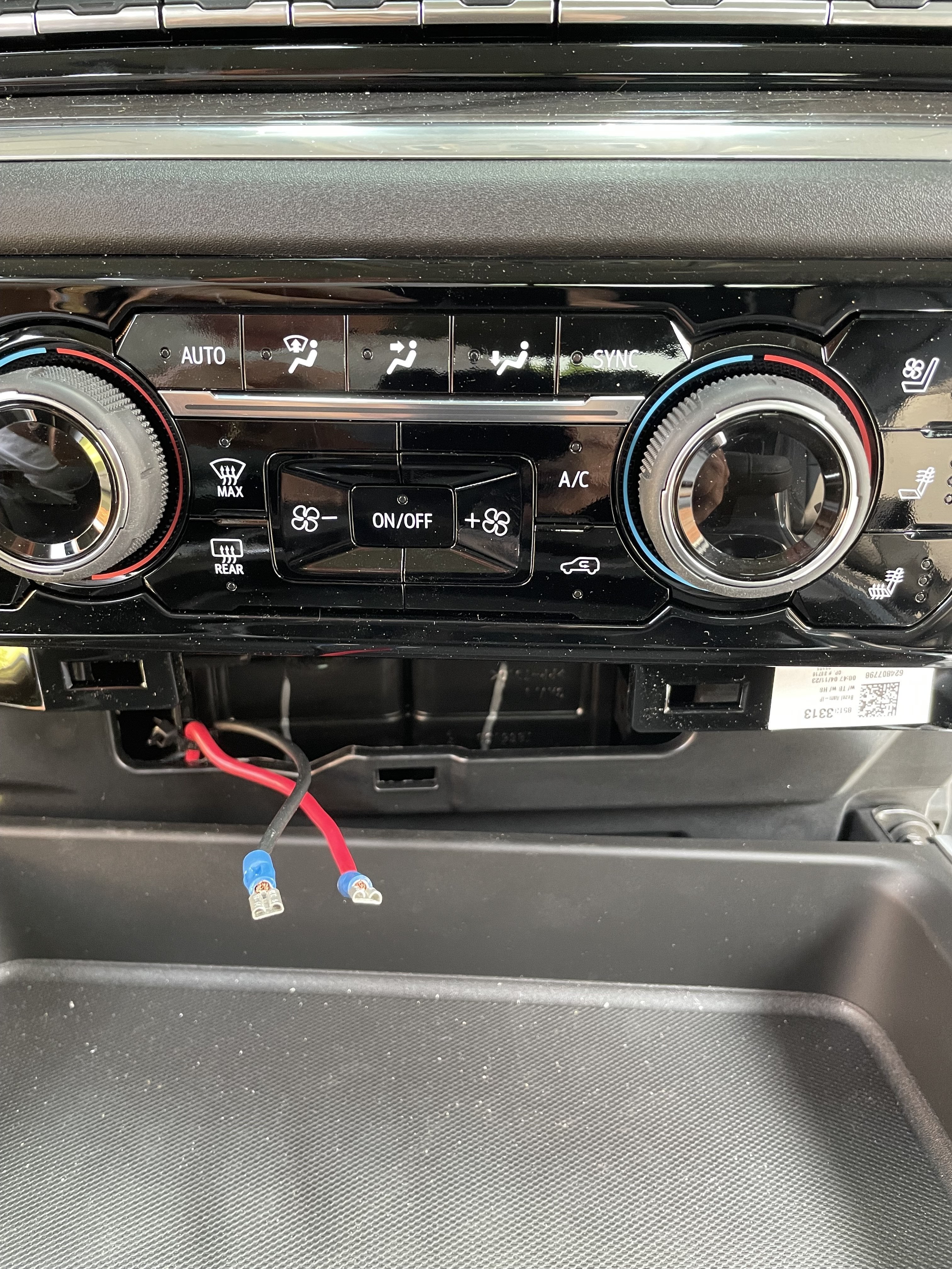 Reinstalling the dashboard trim panel after 12V outlet installation