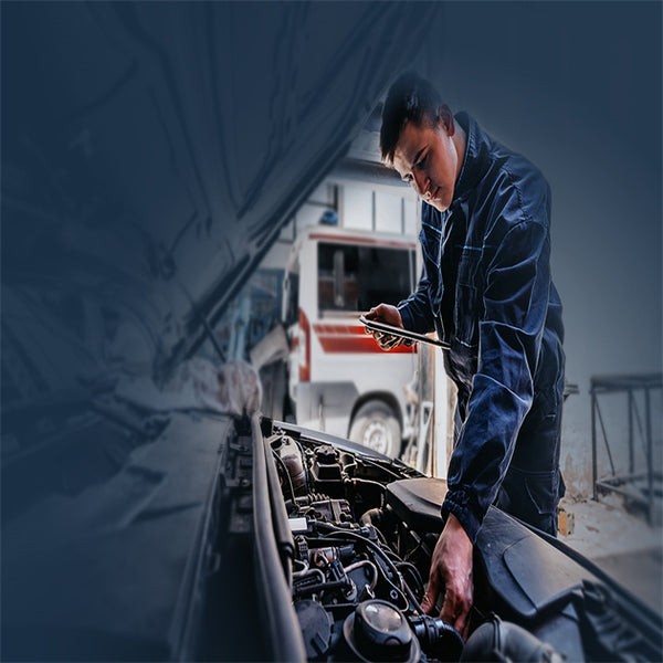 Professional mechanic using diagnostic tools to inspect car key system