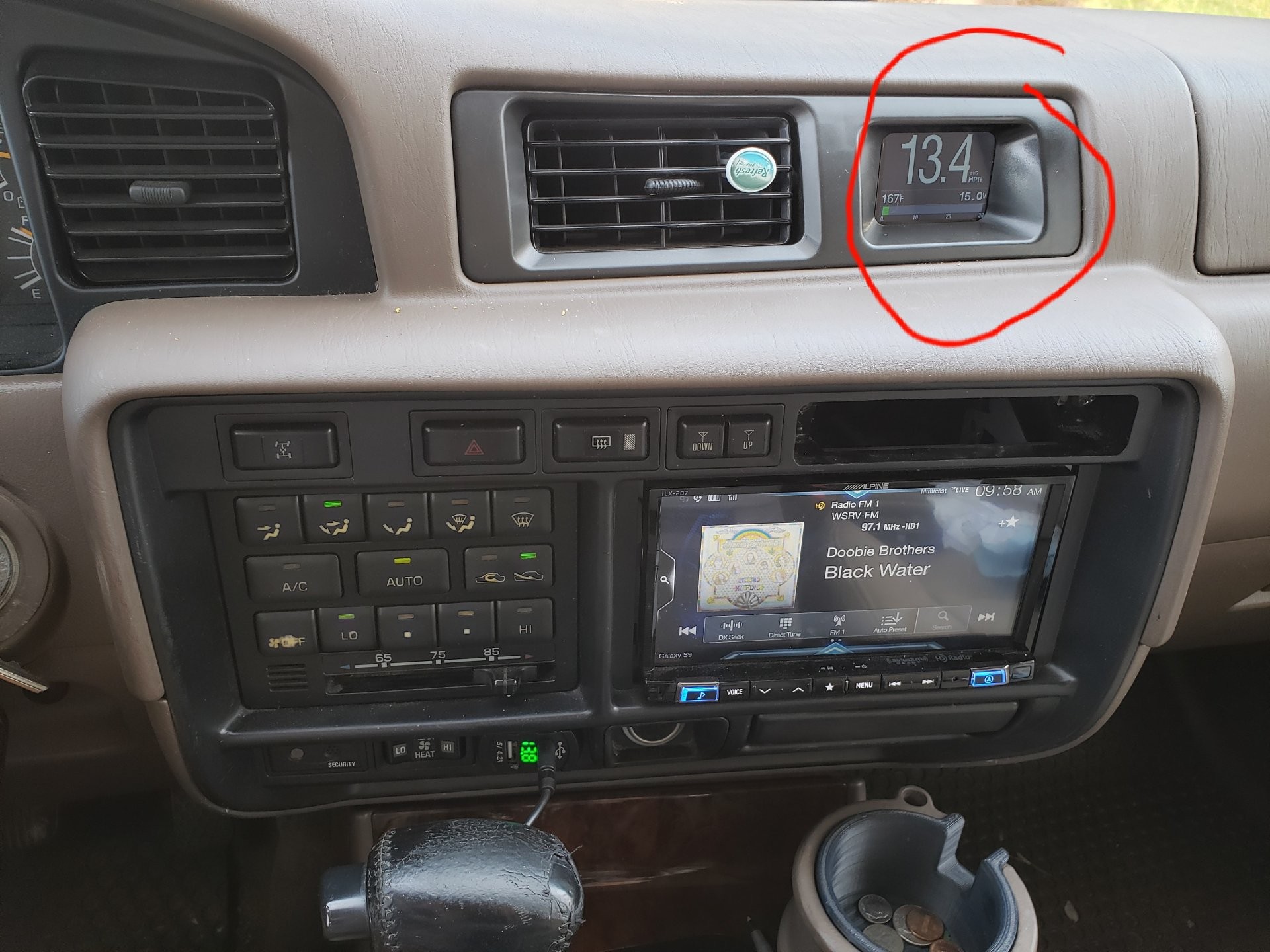 Scangauge OBD2 neatly mounted on a car dashboard, providing a clear view without obstructing driving visibility.