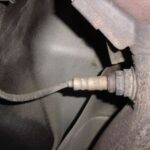 Close-up of a typical oxygen sensor, similar to the Bank 2 Sensor 1 on a 2002 Chevy Blazer, showing the sensor body, threads, and electrical connector.