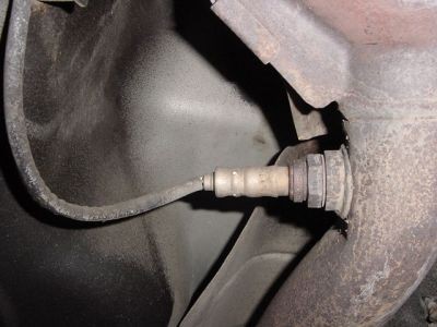 Close-up of a typical oxygen sensor, similar to the Bank 2 Sensor 1 on a 2002 Chevy Blazer, showing the sensor body, threads, and electrical connector.