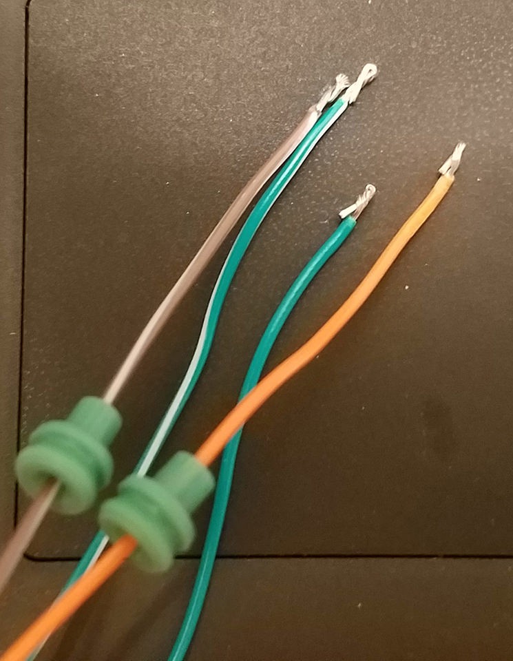 Preparing OBD2 cable wires by folding and twisting to increase thickness for better pin connection