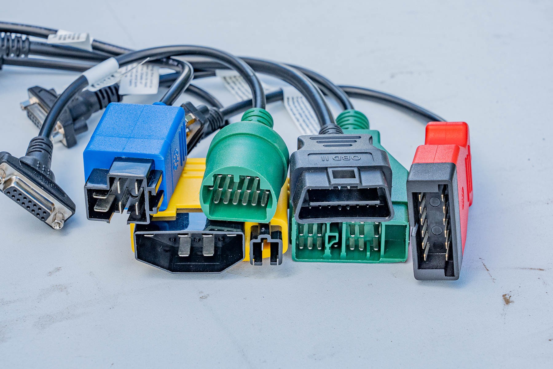 Collection of connectors for OBD2 scanners, highlighting wired connection options