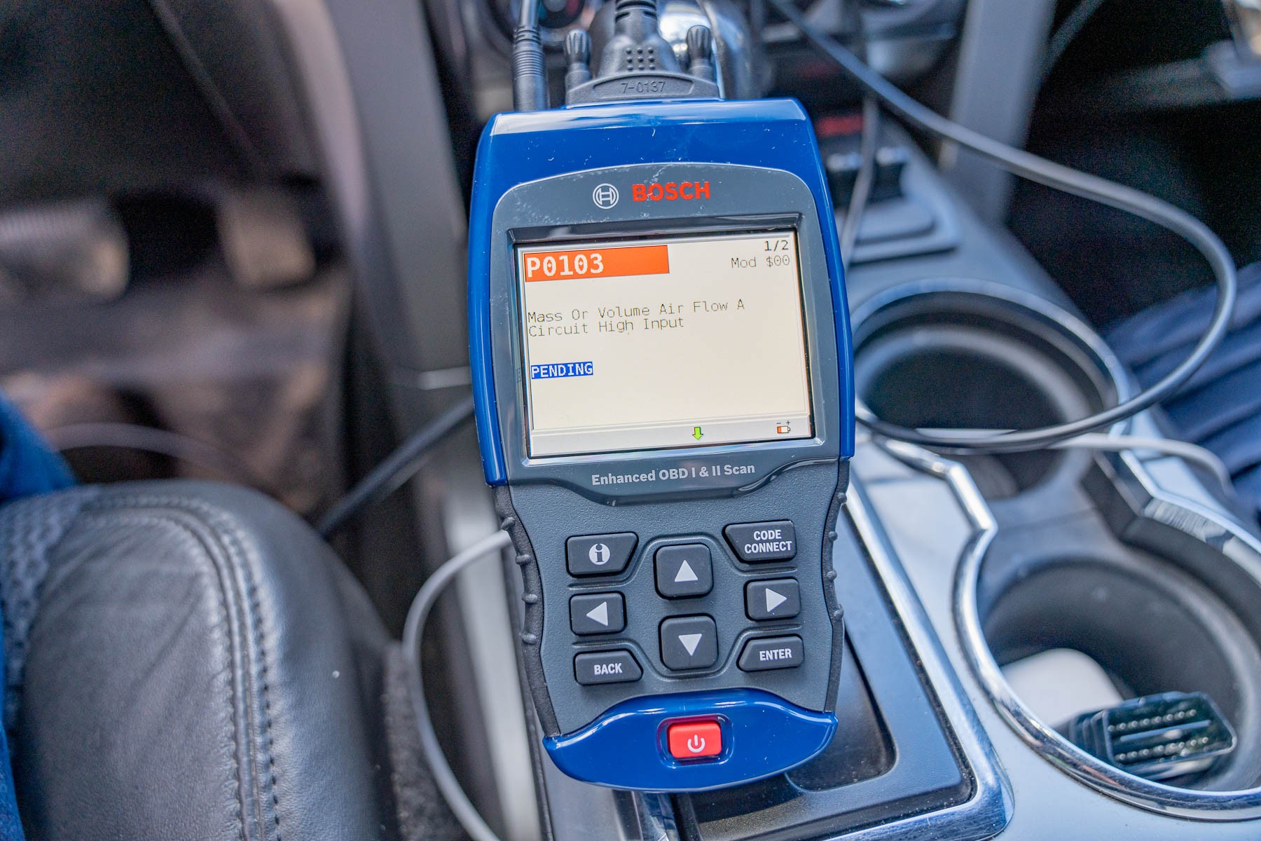 Bosch 1300 OBD scanner in vehicle diagnostic port