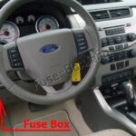 Passenger compartment fuse box location in a 2010 Ford Focus.