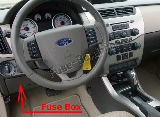 Passenger compartment fuse box location in a 2010 Ford Focus.