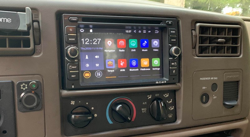 Close-up View of Aftermarket Radio and Physical Buttons in Truck Interior