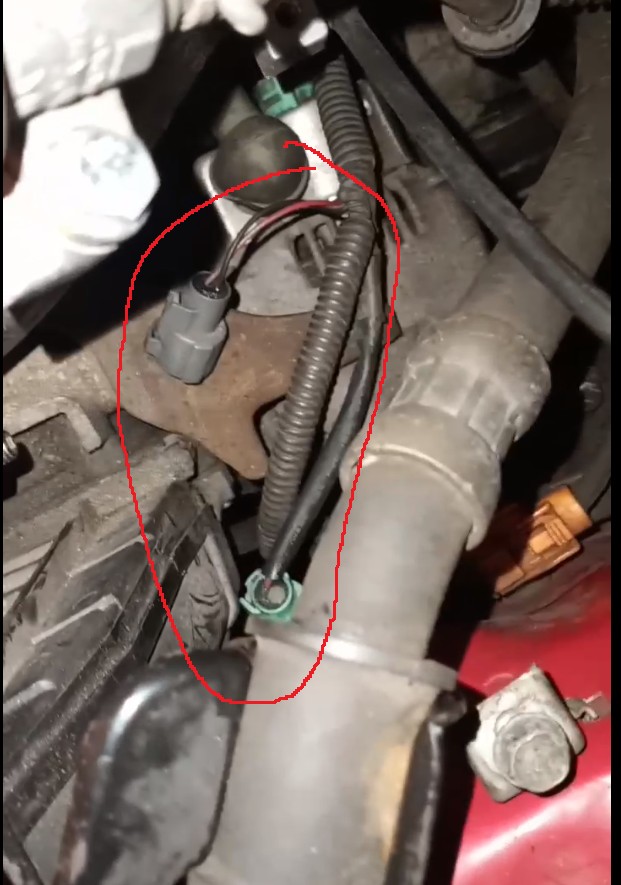 Grey and green connectors near the alternator