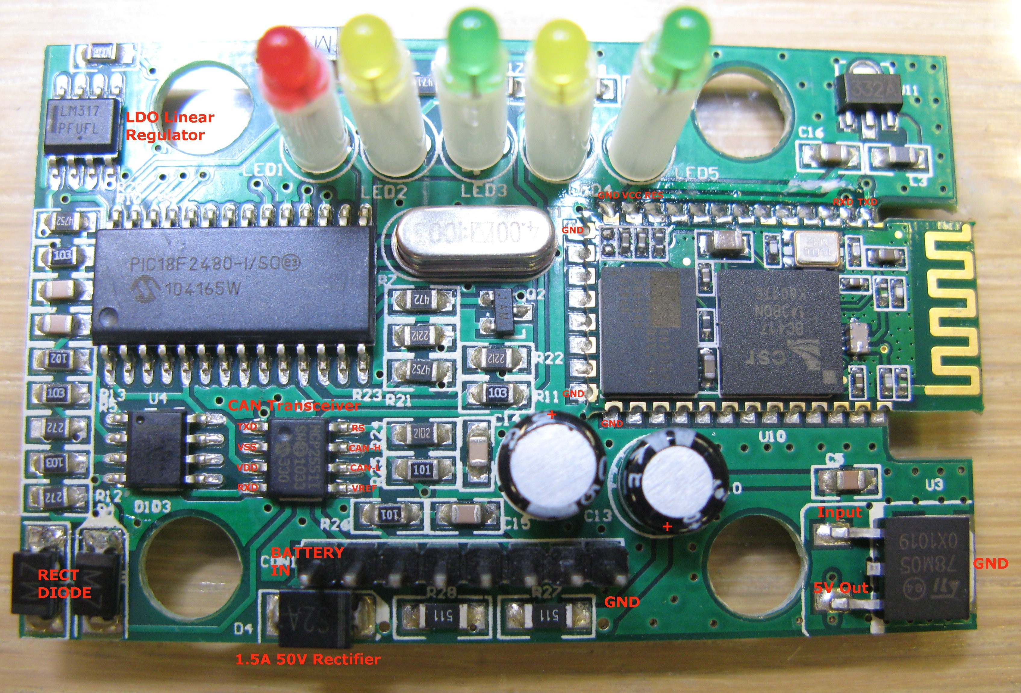 Close up view of the OBD2 adapter PCB after case removal showing electronic components