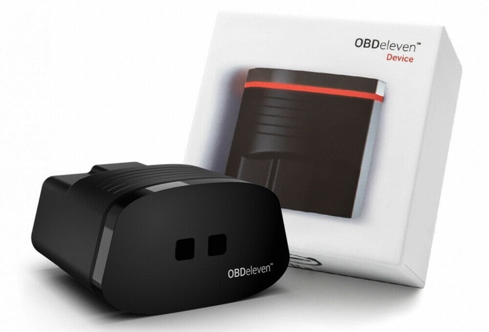 Image of OBDEleven device plugged into a car's OBD2 port, with a smartphone displaying diagnostic information, highlighting the portability and app-based interface