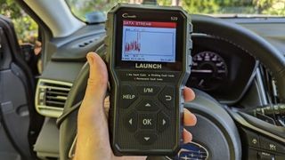 Launch CR529 OBD-II scanner in a handheld format, highlighting its portability and ease of use for quick car diagnostics